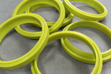 Yellow-green annular seals with raised sealing lips.