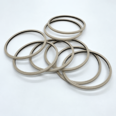 Overlapping beige annular seals with dark inner sealing edges.