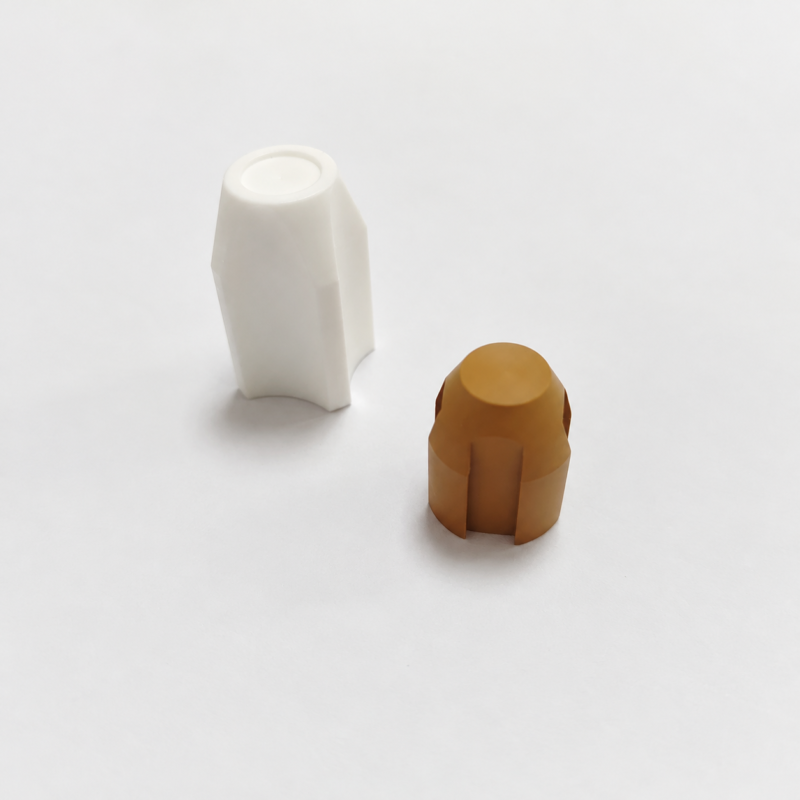 341-ribbed-valve-components-hero White and brown shaped valve components with longitudinal ribs.