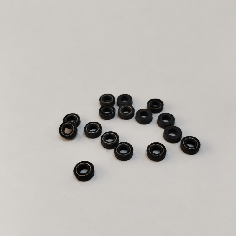 344-black-annular-spring-seals-hero Small black annular seals with visible metal spring elements.