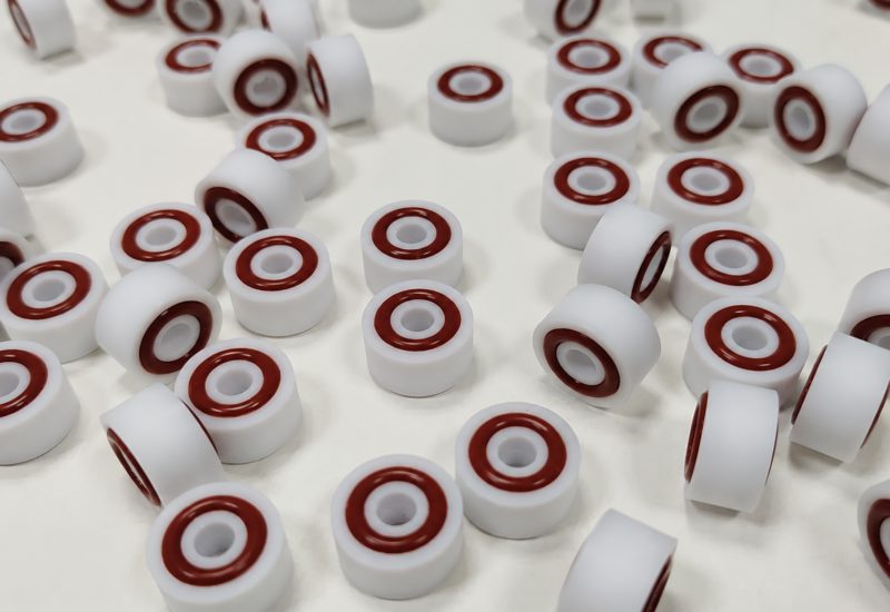 345-white-cylindrical-seals-hero White cylindrical seals with reddish-brown concentric rings.