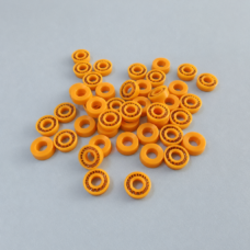 Small yellow annular seals, some with visible metal spring elements.