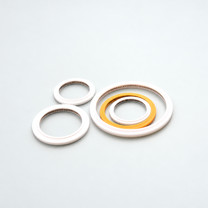 357-laser-cutting-head-spring-energized-seals White and yellow annular seals with visible internal metal springs.