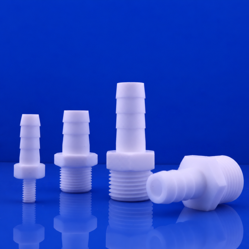 IKSONIC-PTFE-Hose-Barb-Male-Threaded-Fittings-Wholesale IKSONIC PTFE hose barb fittings for wholesale, with three upright male-threaded fittings and one horizontal fitting.