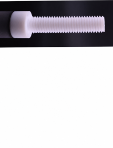 Side detail of a white IKSONIC PTFE socket-head screw, with the cylindrical head at left and threaded shaft extending to the right.
