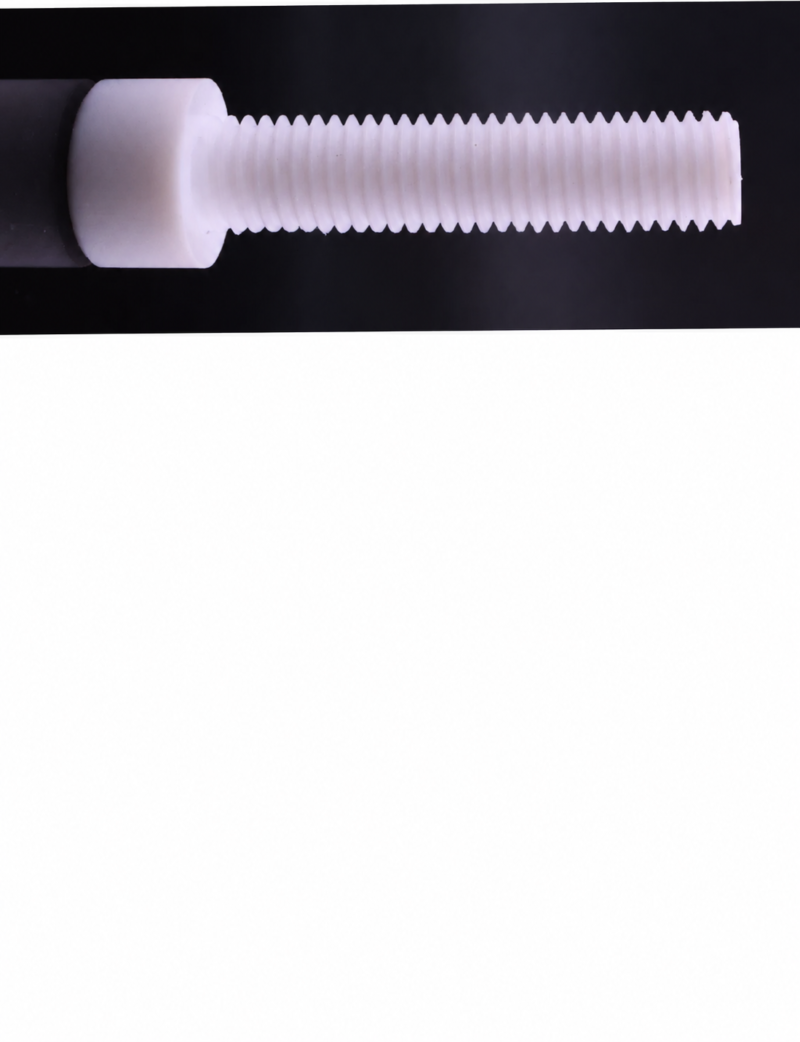 Side detail of a white PTFE socket-head screw lying horizontally against a dark background, with the head at left and threaded shaft extending right; the lower panel is blank white.