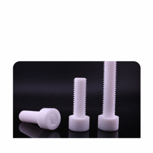 Three white IKSONIC PTFE socket-head screws on a dark background, showing a hexagonal socket, threaded shafts and upright profiles.