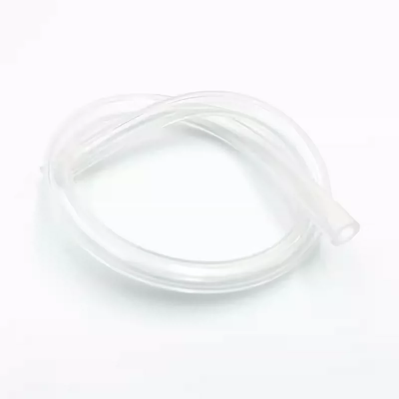 Clear silicone tubing loosely coiled on a white background with an open end at the right.