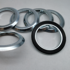 Assorted SES-branded RE motor oil seals supplied by IKSONIC, with overlapping silver metal faces and a black-lipped seal in the foreground.