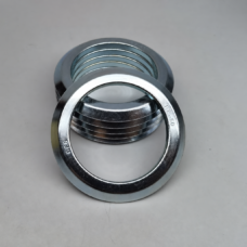 Stacked SES-branded RE metal motor oil seals supplied by IKSONIC, with an engraved seal leaning in front.