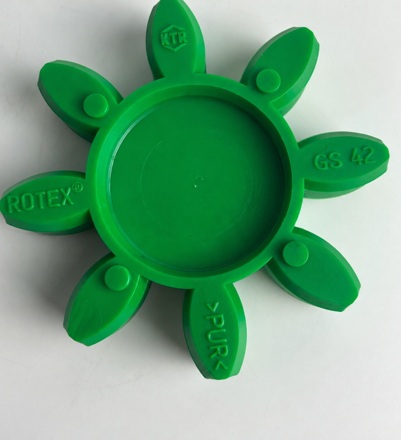 Supplier photo for IKSONIC: cropped detail of a green GS42 eight-arm coupling spider with original KTR, ROTEX and PUR markings; the upper tip and far-left edge are outside the frame.