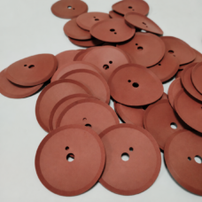 Reddish-brown cup seals with a central opening and smaller offset hole, arranged in overlapping groups.