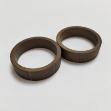 Two brown guide rings shown side by side with their inner openings and rectangular cross sections visible.