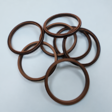 Six overlapping brown sealing rings showing flat and grooved profiles.