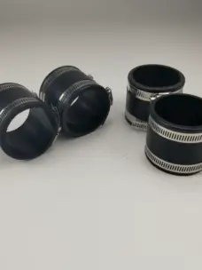 Four black straight pipe connectors with metal hose clamps.