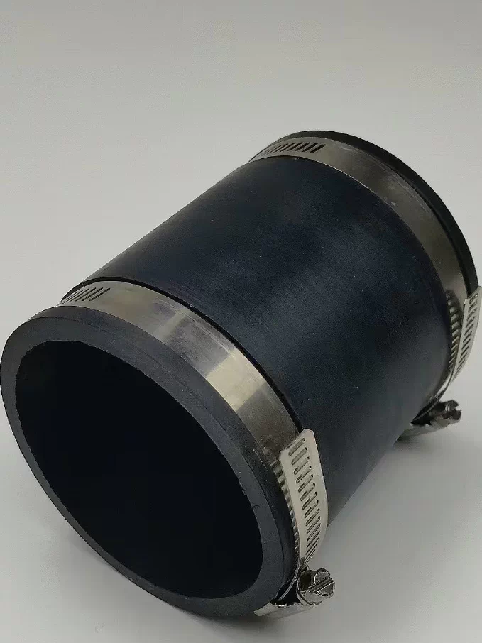 Clamp-style straight pipe connector Black straight pipe connector with two metal hose clamps, shown at an angle.