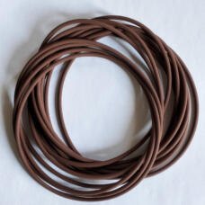 Brown round-section O-rings overlapping on a white surface.