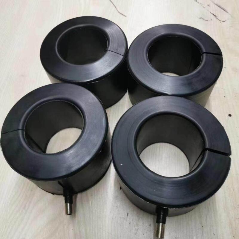 Four black cylindrical inflatable seals with open centers and inflation fittings.