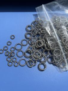 Metal energizing spring components shown separately in the dispensing valve seal listing.