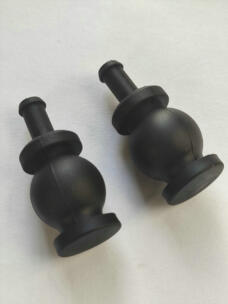 Two black gimbal damping balls showing spherical bodies, flanges and mounting stems