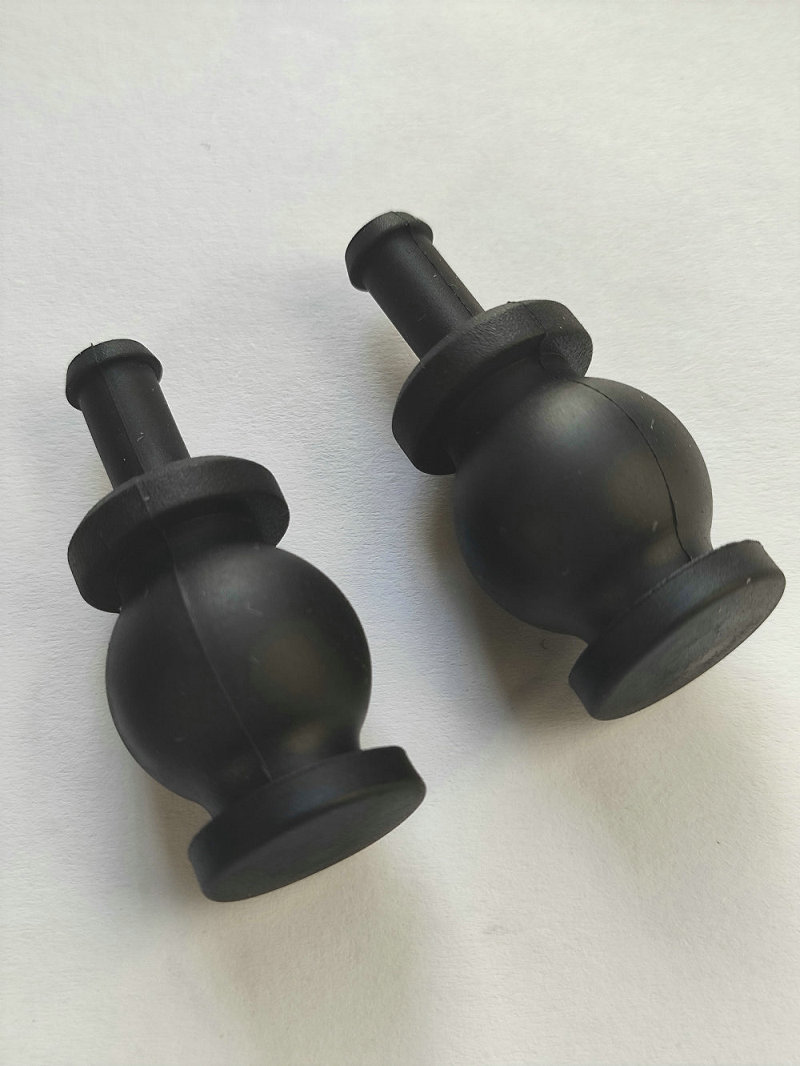Two black gimbal damping balls showing spherical bodies, flanges and mounting stems