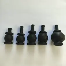 Five black gimbal damping balls of different sizes arranged in a row