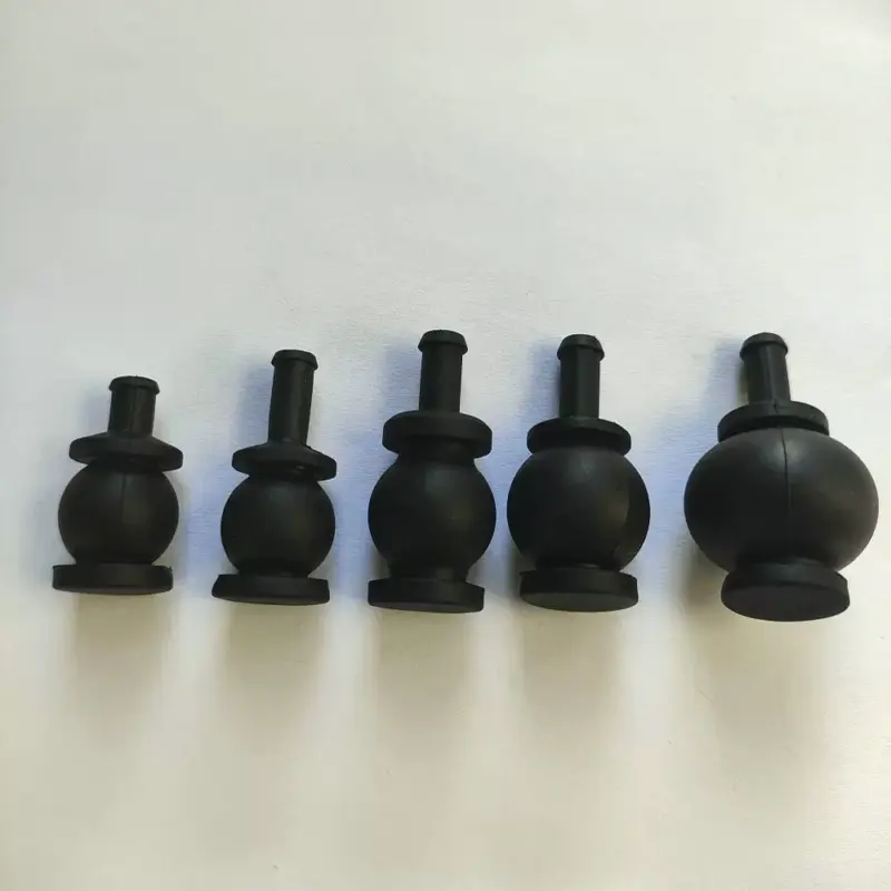 Gimbal damping balls standard and larger sizes Five black gimbal damping balls of different sizes arranged in a row