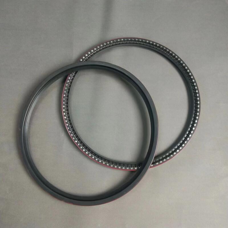 Two large shaft sealing rings showing smooth sealing faces and exposed segmented inner edges