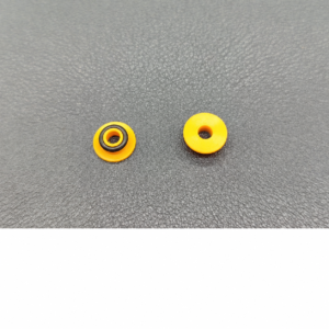 Two IKSONIC yellow chromatography pump seals side by side, one fitted with a black ring.