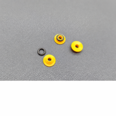 Supplier photograph of three yellow chromatography pump seals and one separate black ring.