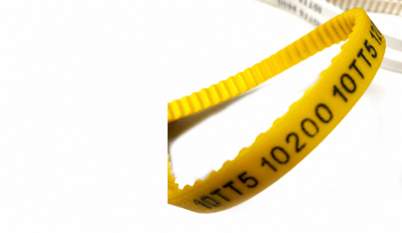 Close-up of yellow 10TT5 polyurethane timing belt teeth and model marking; supplied by IKSONIC in China.