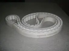 Light-coloured IKSONIC toothed timing belt showing its 25AT20-1540+2PU marking and outer covering.