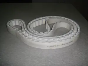 Light-coloured IKSONIC toothed timing belt showing its 25AT20-1540+2PU marking and outer covering.