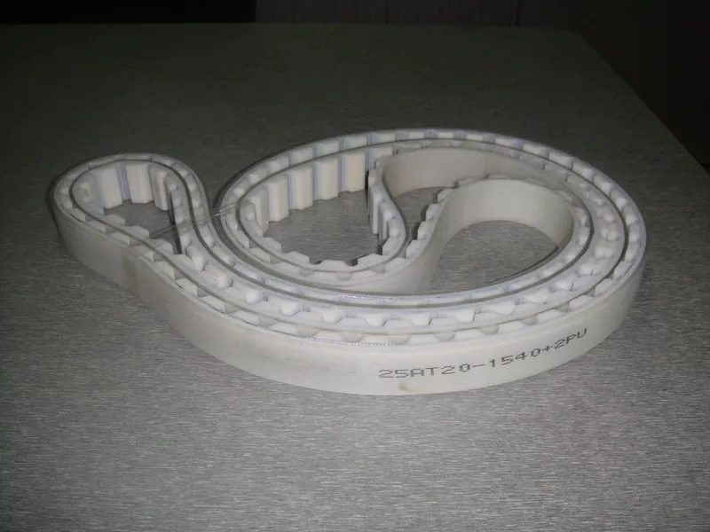 iksonic-25at20-1540-2pu-timing-belt-china-supplier Light-coloured IKSONIC toothed timing belt showing its 25AT20-1540+2PU marking and outer covering.