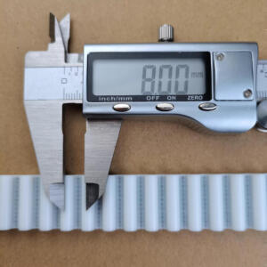 White IKSONIC timing belt sample beside a digital caliper displaying 8.00 mm.