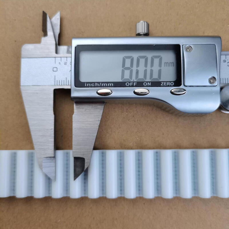 White IKSONIC timing belt sample beside a digital caliper displaying 8.00 mm.