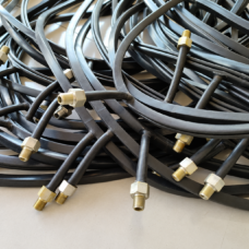 Black inflatable seals with threaded metal fittings from IKSONIC, a China supplier.