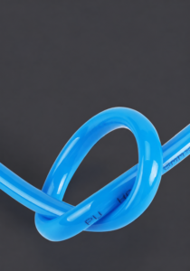 Blue IKSONIC polyurethane pneumatic tubing loop with PU material marking visible.