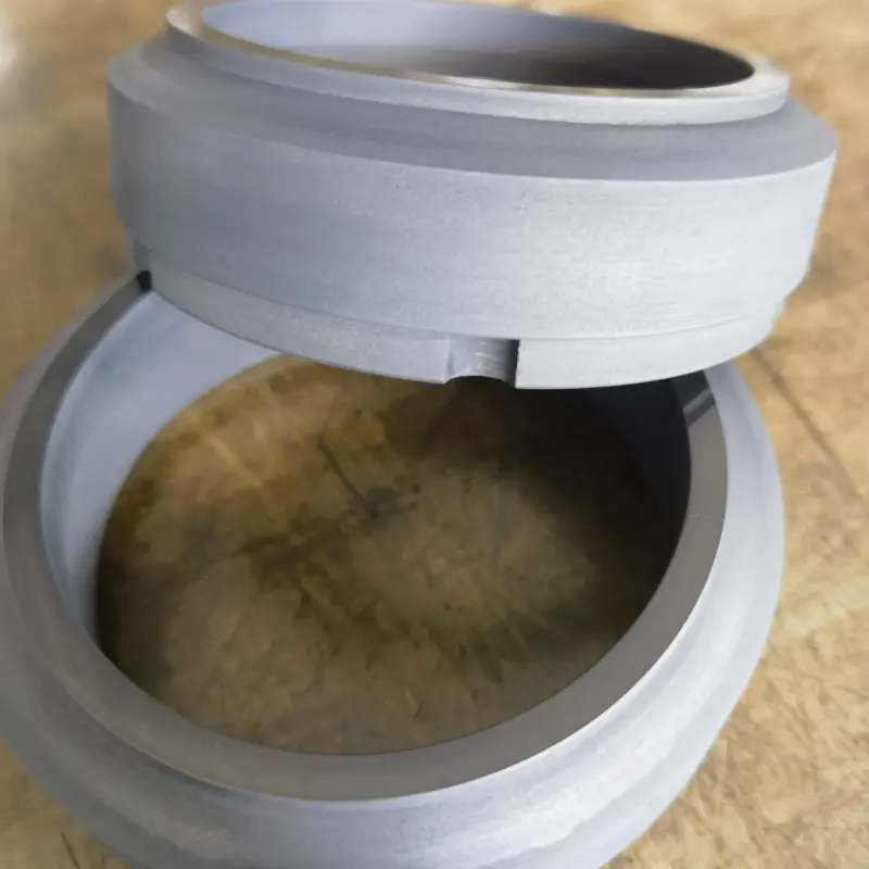 Profile view of C8B-series graphite rotating seal rings showing the stepped outer profile and notch.