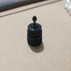 Upright black cylindrical valve component with a central stem and domed tip; supplied by IKSONIC in China.
