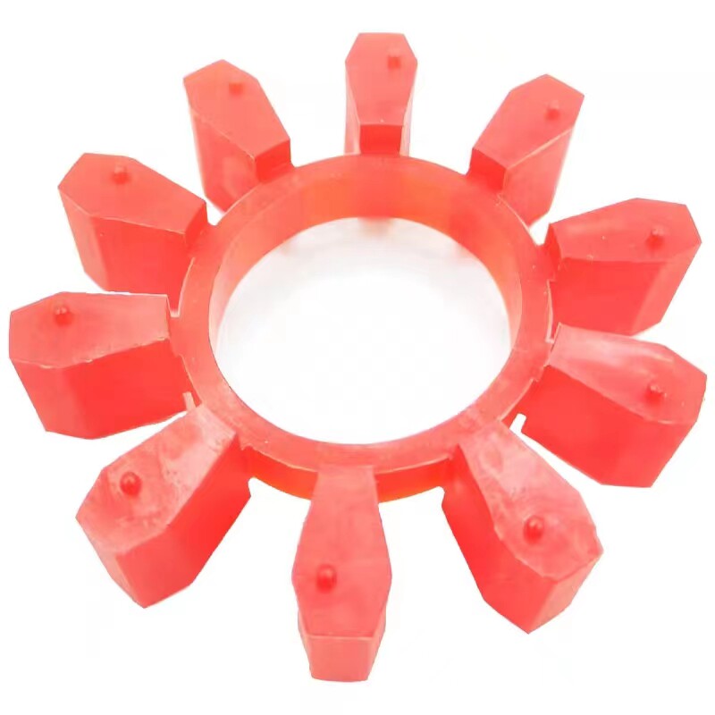 Angled view of a red ten-lobe coupling insert on a white surface; supplied by IKSONIC in China.