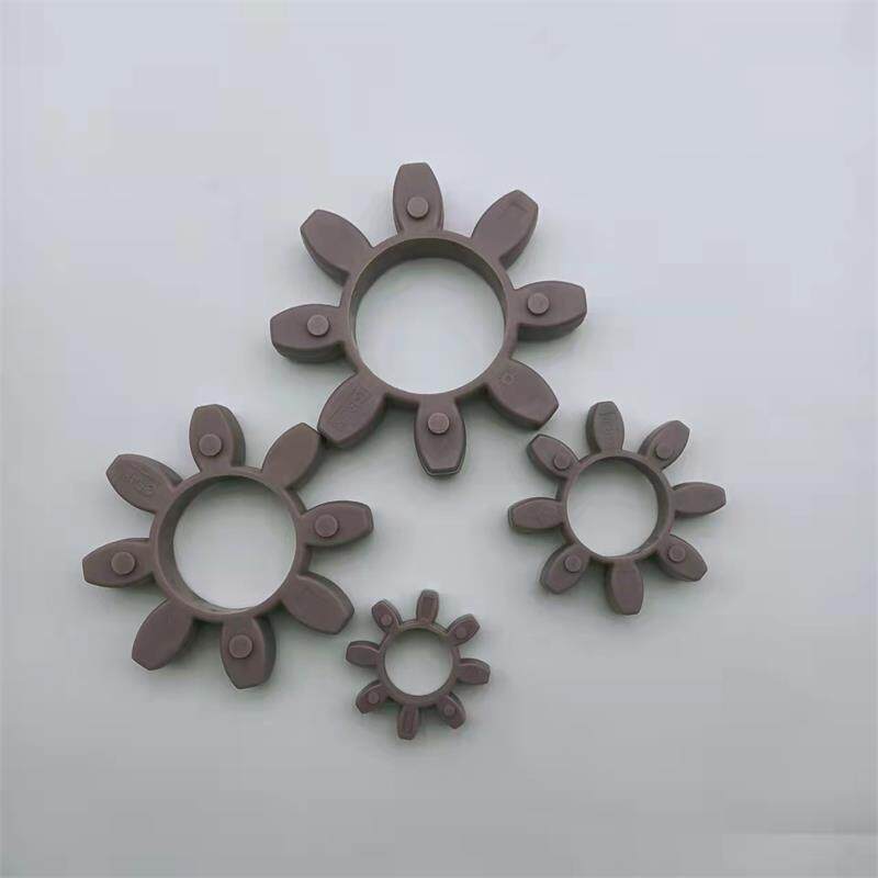 Four purple-grey star coupling inserts of different sizes on a pale background; supplied by IKSONIC, China.
