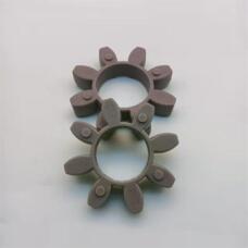 Two overlapping purple-grey eight-lobe coupling inserts viewed at an angle; supplied by IKSONIC, China.