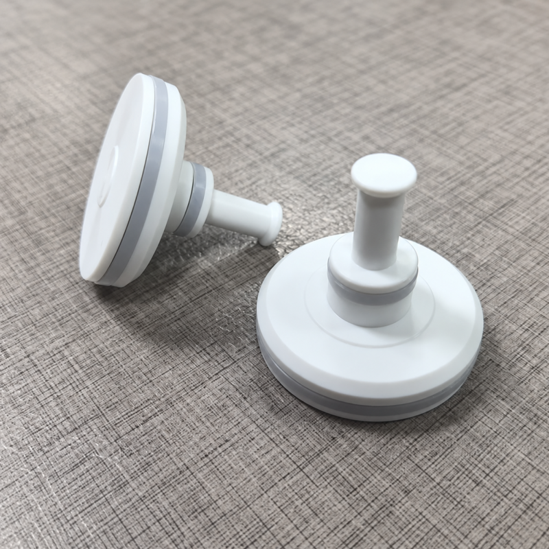 IKSONIC white piston valve parts - China supplier Two white piston-shaped valve parts with stems and grey circumferential bands; supplied by IKSONIC in China.