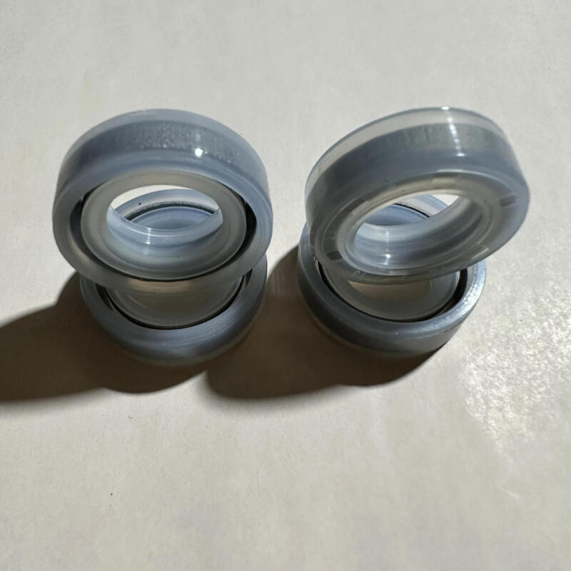 Silicone oil seals manufactured by IKSONIC, stacked in two pairs.