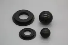 Two black pump balls with stepped ring seats shown in different sizes, IKSONIC supplier product detail