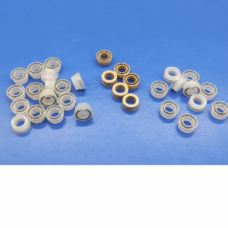White and tan dispensing valve seal examples with visible spring inserts on a blue surface, supplied by IKSONIC in China
