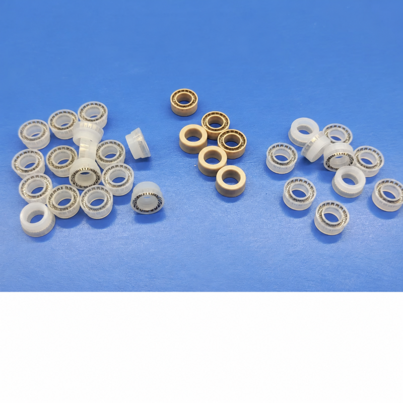 iksonic-dispensing-valve-spring-seals-china-supplier-overview White and tan dispensing valve seal examples with visible spring inserts on a blue surface, supplied by IKSONIC in China