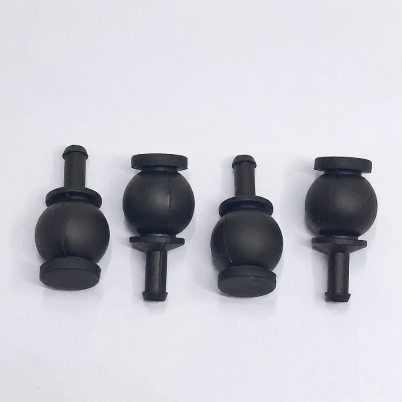 iksonic-dji-compatible-gimbal-damper-supplier-four-piece-main Four black DJI-compatible gimbal dampers in alternating orientations, available from IKSONIC as an aftermarket parts supplier.