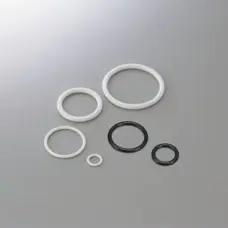 Six black and white FFKM O-rings in assorted sizes on a gray surface, supplied by IKSONIC in China.